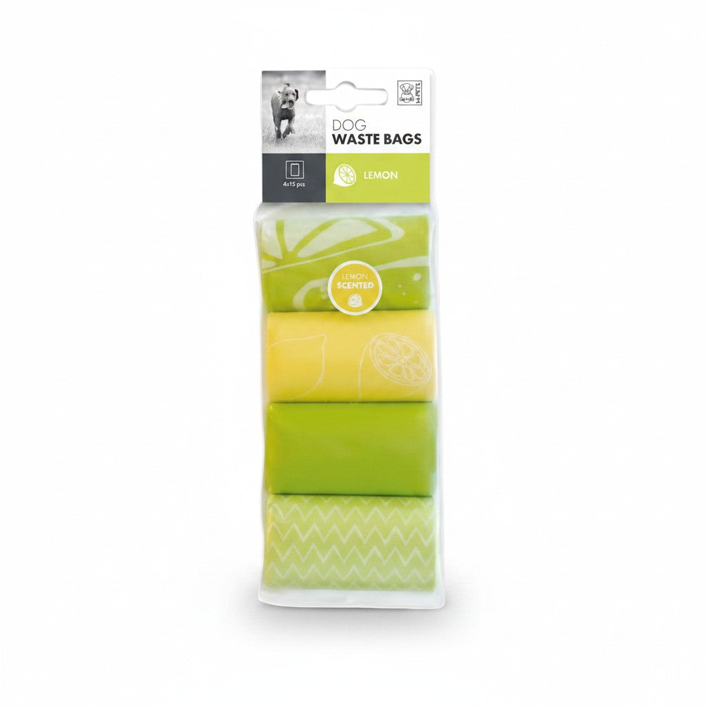 Paquet M-PETS contenant 4 rouleaux de 15 sacs à déjections pour chien parfumés au citron, dans des tons verts et jaunes avec motifs.
